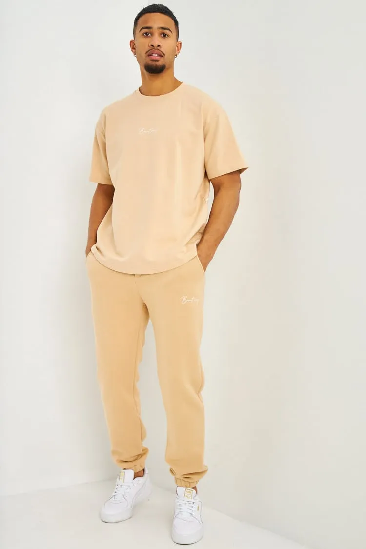 Pantalon de jogging beige foncé inscription Brentiny