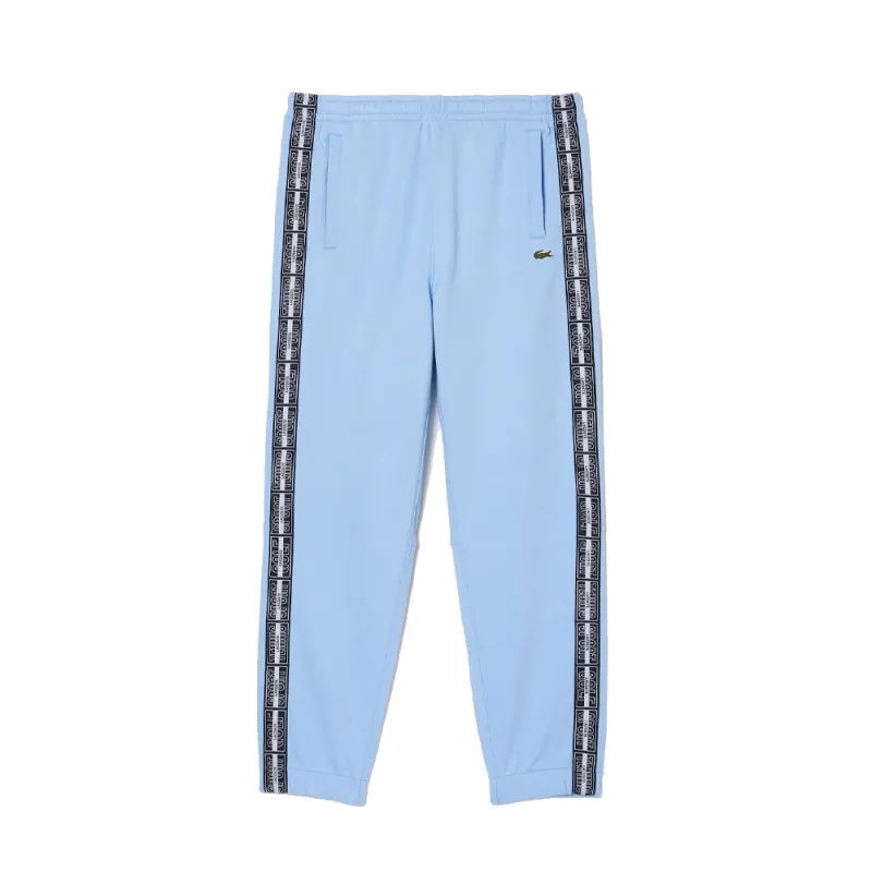 PANTALON DE SURVÊTEMENT LACOSTE JOGGER BLEU CIEL AVEC BANDES SIGLÉES