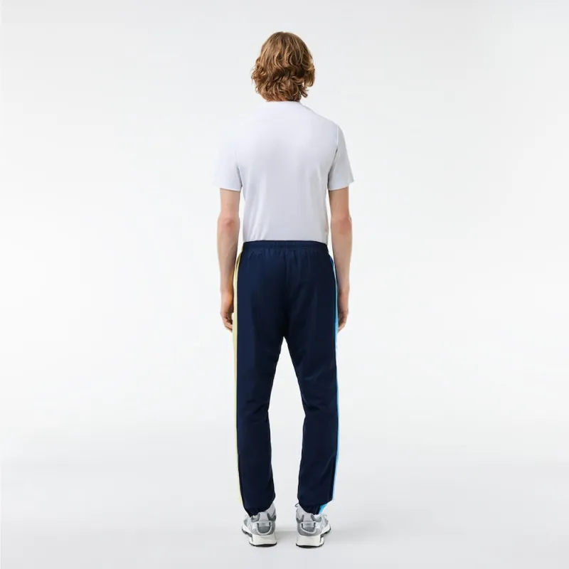 PANTALON DE SURVÊTEMENT LACOSTE TENNIS SPORTSUIT LÉGER BLEU MARINE