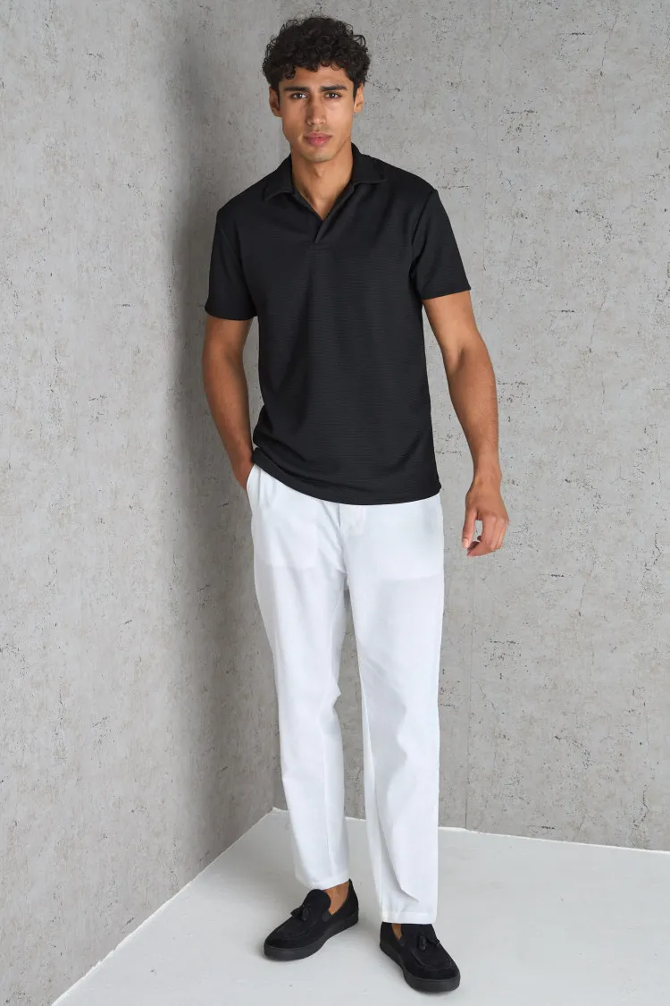 Polo basic noir texturé