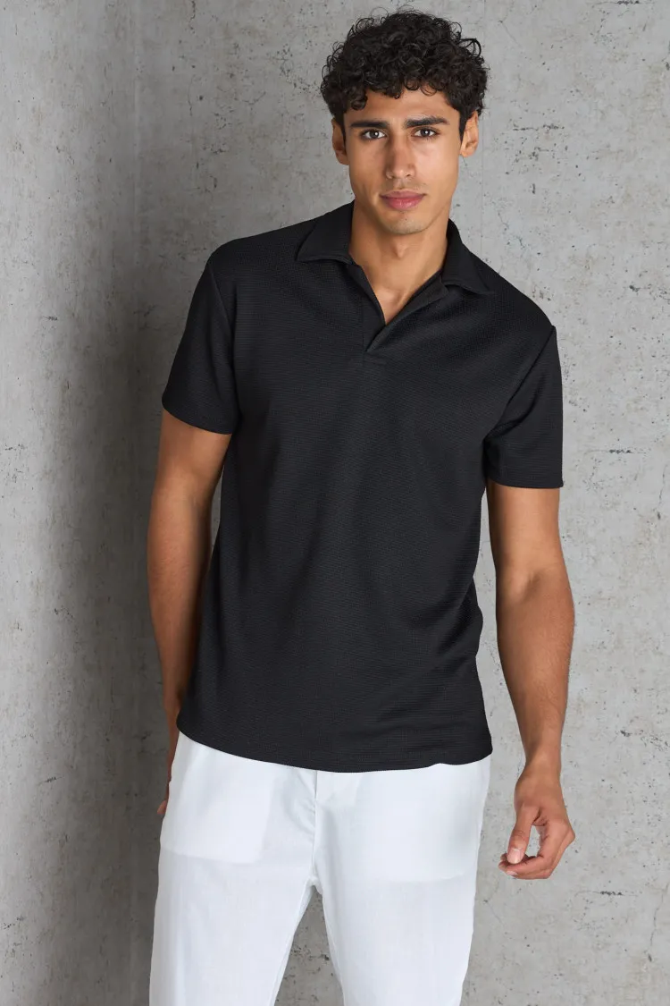 Polo basic noir texturé